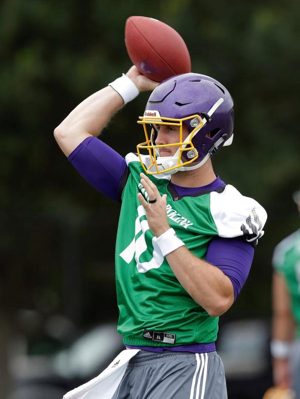 East Carolina quarterback Thomas Sirk passes during an NCAA college football practice in Greenville, N.C., Friday, Aug. 4, 2017.