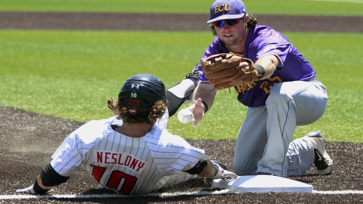 East Carolina's Eric Tyler (25) loses the ball before making the late tag on Texas Tech's (10) Tyler Neslony in the 8th inning of an NCAA college baseball tournament super regional game in Lubbock, Texas.