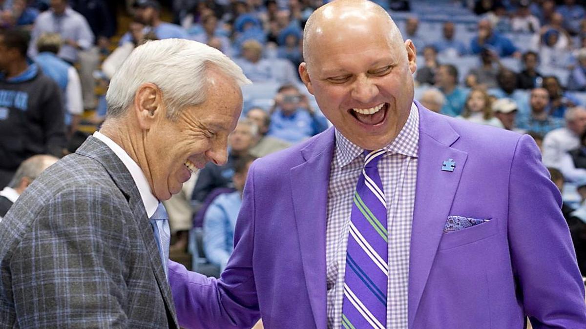UNC coach Roy Williams and East Carolina coach Jeff Lebo, a former Tar Heel, chat prior to the game between North Carolina and East Carolina on Sunday, December 7, 2014 at the Smith Center in Chapel Hill, N.C.