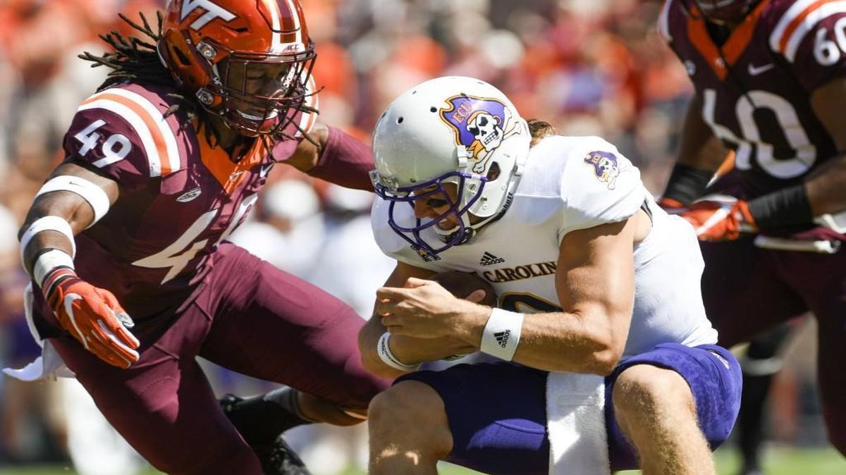 Virginia Tech Linebacker Tremaine Edmunds (49) closes in on East Carolina quarterback Philip Nelson in the first half at Lane Stadium in Blacksburg.
