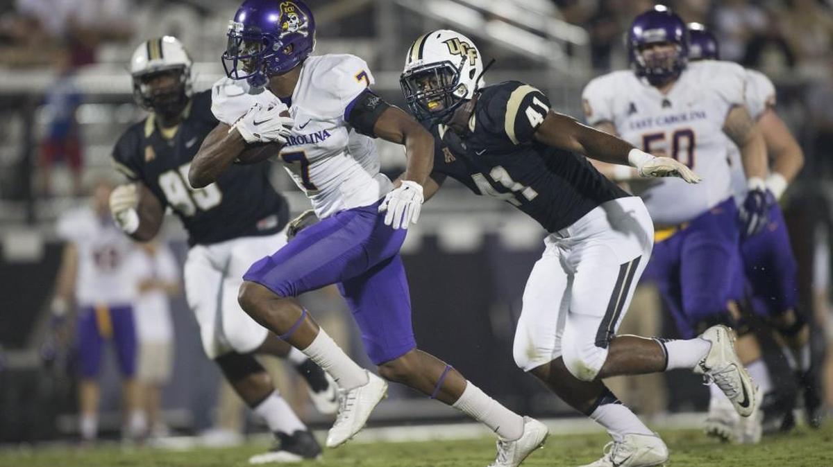 East Carolina wide receiver Isaiah Jones (7) runs from Central Florida linebacker Demeitre Brim (41) during the first half in Orlando, Fla.