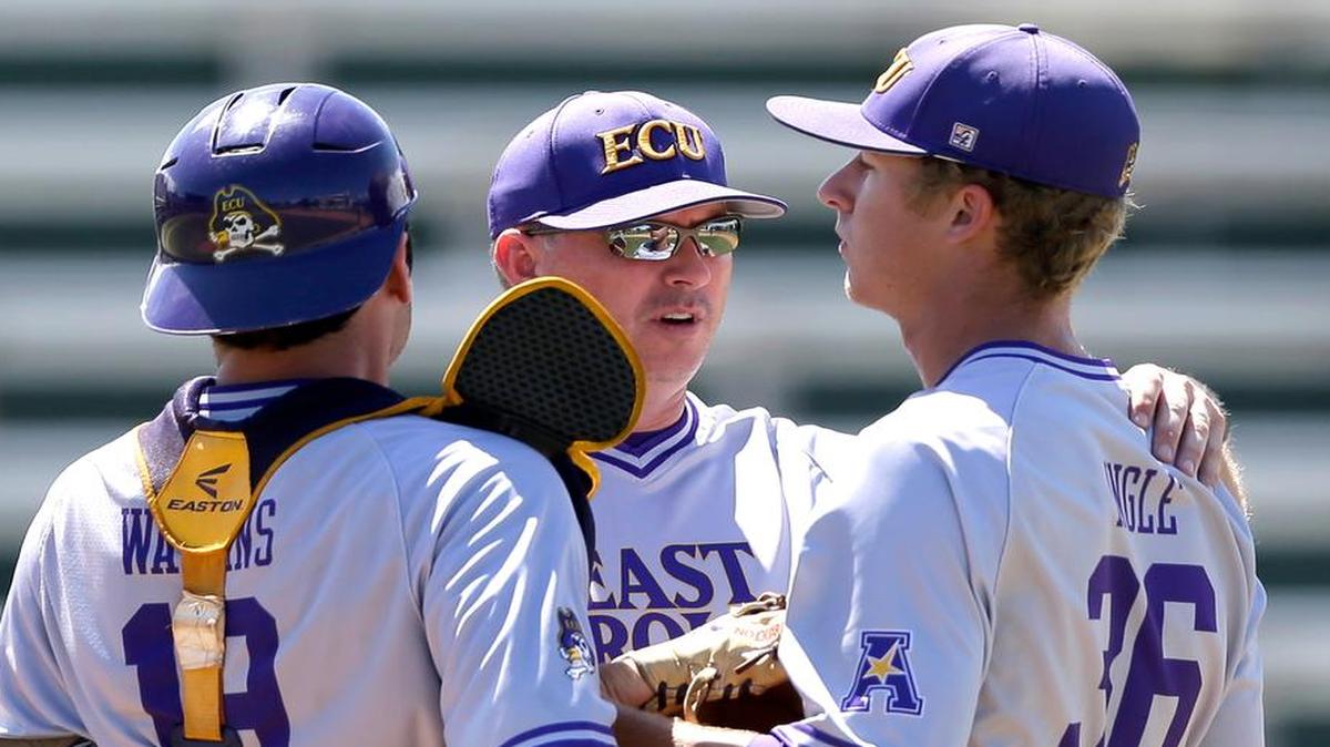 
East Carolina coach Dan Roszel, center, talks to relief pitcher Joe Ingle (36) and catcher Travis Watkins (19) after Florida International scored two runs in the eighth inning of the NCAA college baseball regional tournament in Coral Gables, Fla., Saturday, May 30, 2015. FIU won 2-0.
