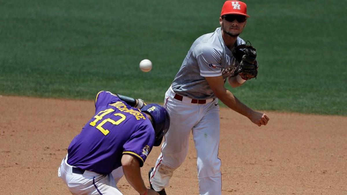 Houston infielder Connor Hollis forces East Carolina's Spencer Brickhouse (42) at second base and relays the throw to first in time to turn a double play on Turner Brown during the sixth inning of the American Athletic Conference championship game May 28 in Clearwater, Fla.