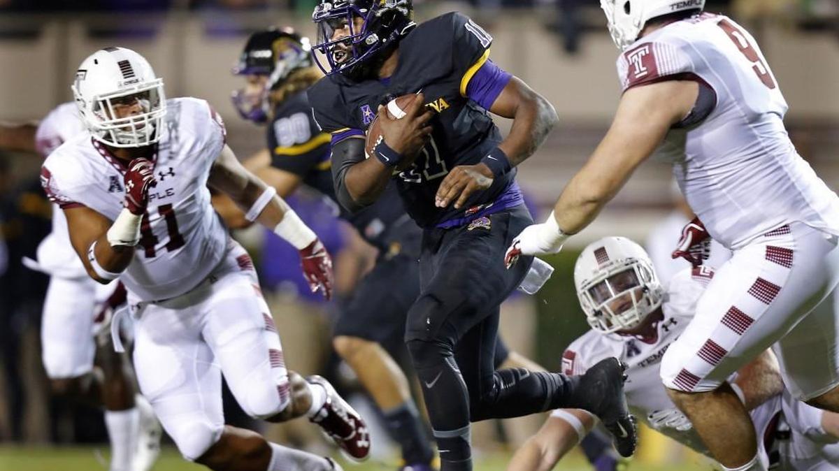 ECU’s James Summers (11) runs against Temple’s Jarred Alwan (41) and Matt Ioannidis (9) on Oct. 22. The Pirates close their 2016 regular season on the road against the Owls on Nov. 26.