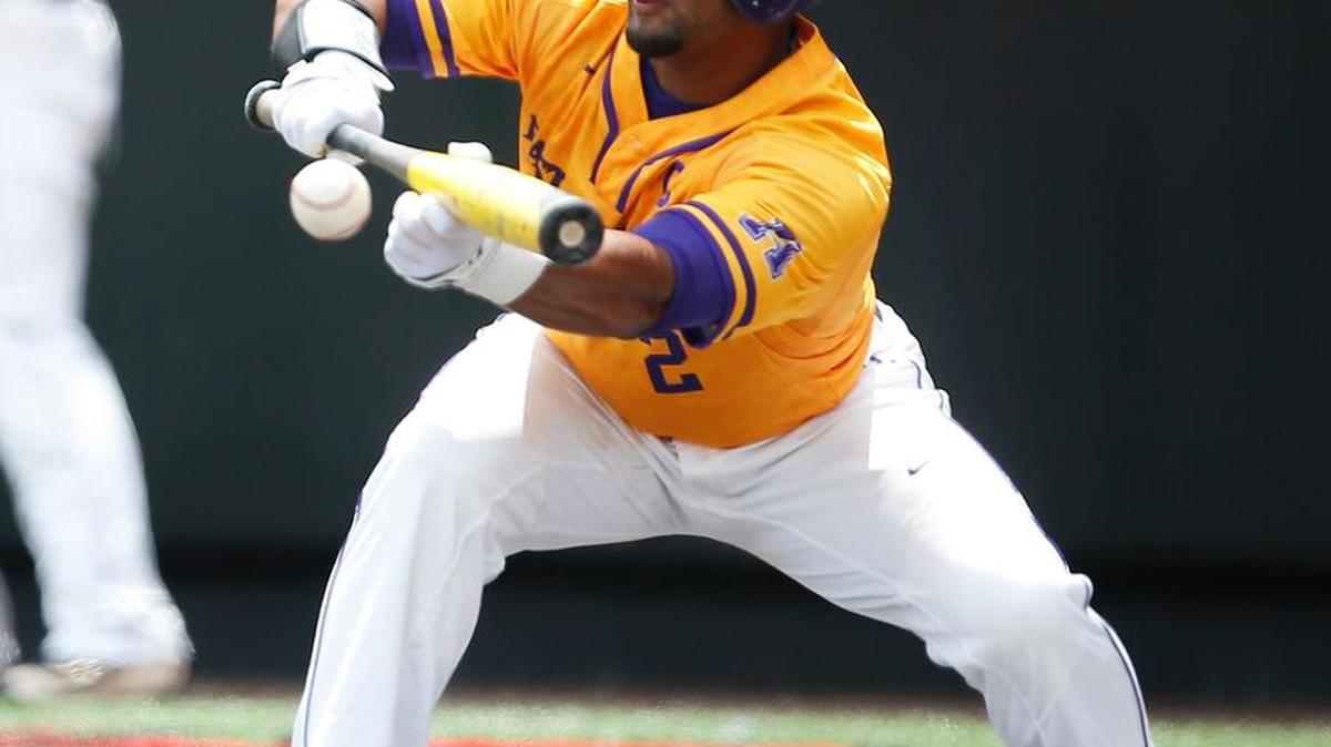 ECU’s Garrett Brooks bunts during a super regional game against Texas Tech on Saturday in Lubbock, Texas.