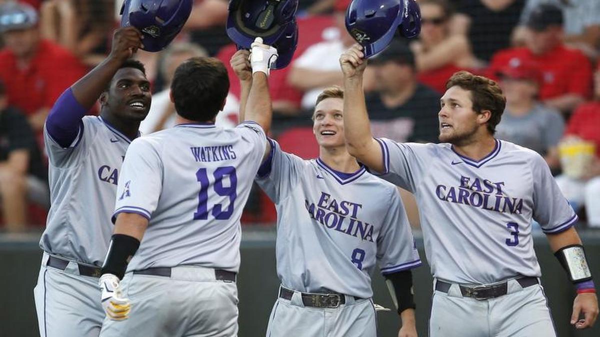 East Carolina's Dwanya Williams-Sutton, Turner Brown (8), and Charlie Yorgen (3) celebrate with Travis Watkins (19) after he hit a grand slam against Texas Tech during their NCAA college baseball tournament super regional game in Lubbock, Texas.