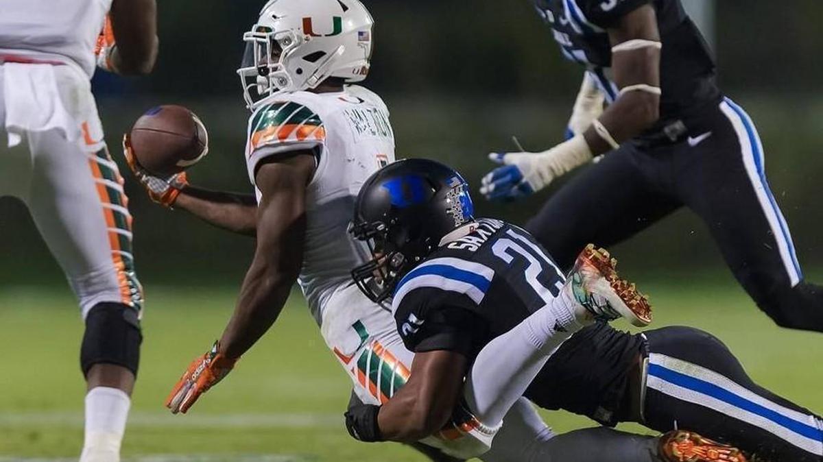 Duke cornerback Alonzo Saxton tackles Miami's running back Mark Walton during the eight-lateral play at the end of the Oct. 31 game. After a long video review of the play game officials ruled the Hurricanes player was not down and gave Miami the touchdown and win.