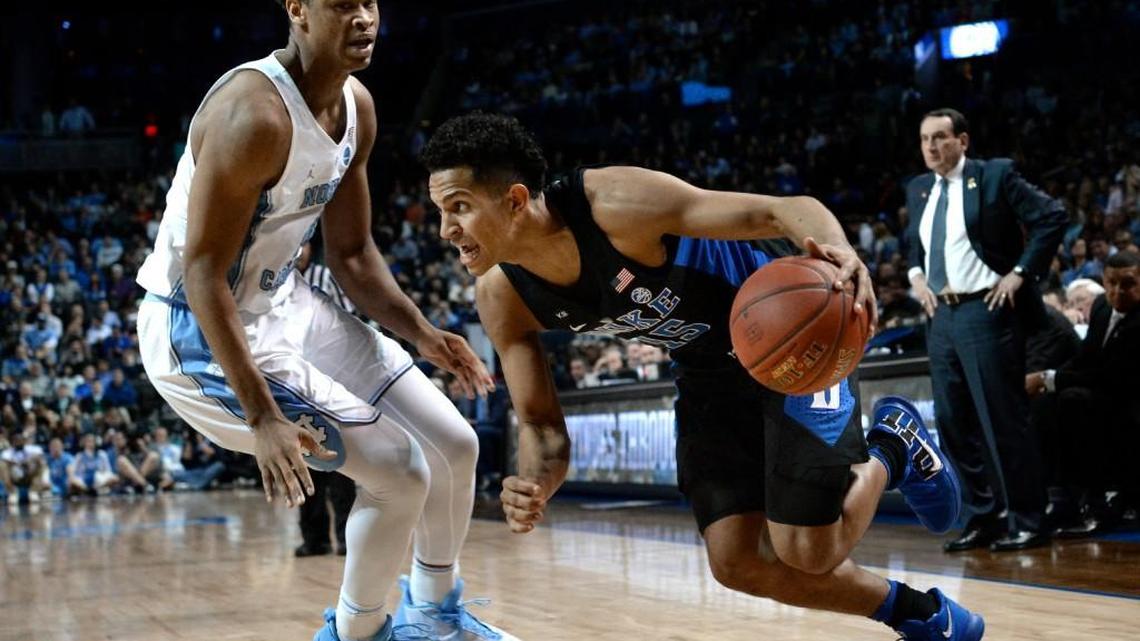 Duke guard Frank Jackson (15) moves against UNC forward Isaiah Hicks during the ACC tournament at the Barclays Center in Brooklyn, N.Y., on March 10, 2017