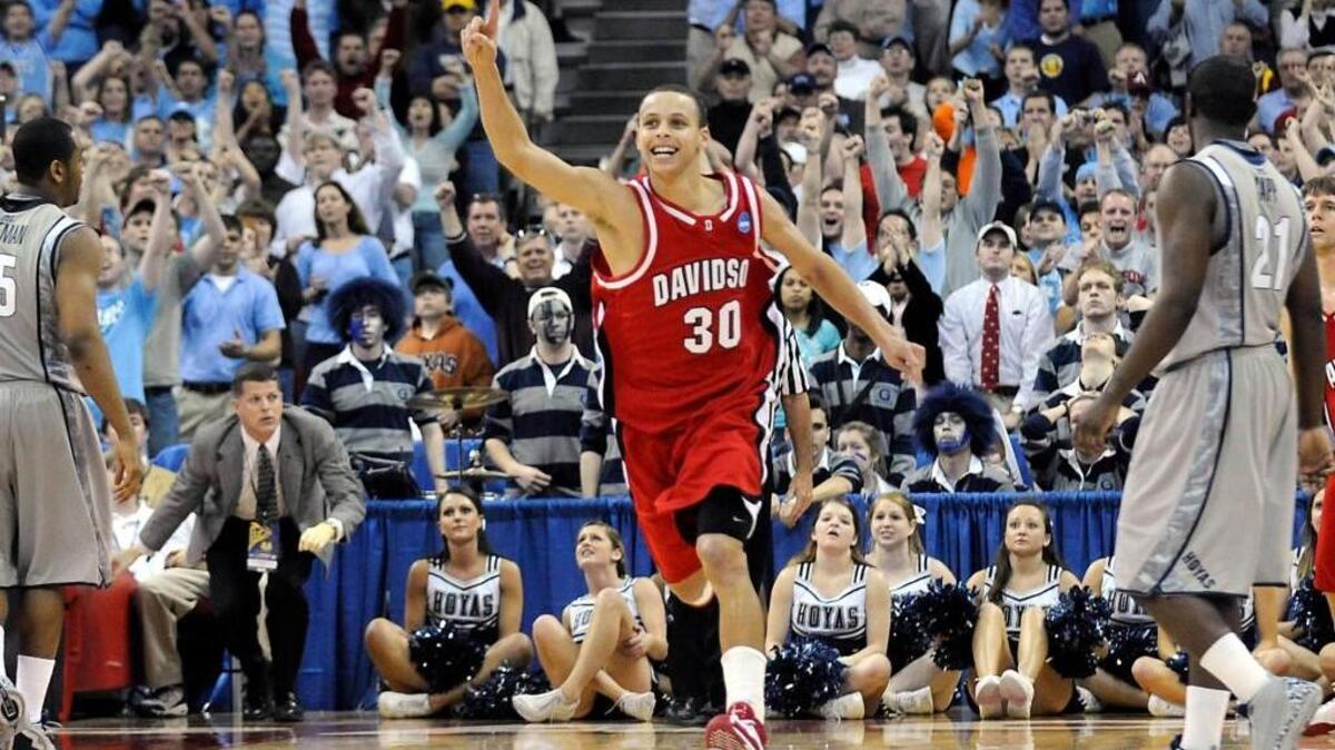 Davidson's Stephen Curry (#30) celebrates as the buzzer sounds in their 74-70 victory over Georgetown in the NCAA tournament at the RBC Center in Raleigh in 2008.