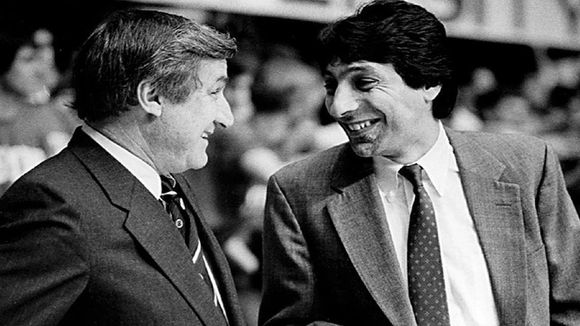 UNC head coach Dean Smith, left, and NC State head coach Jim Valvano talk before a game. State defeated UNC 85-76.
