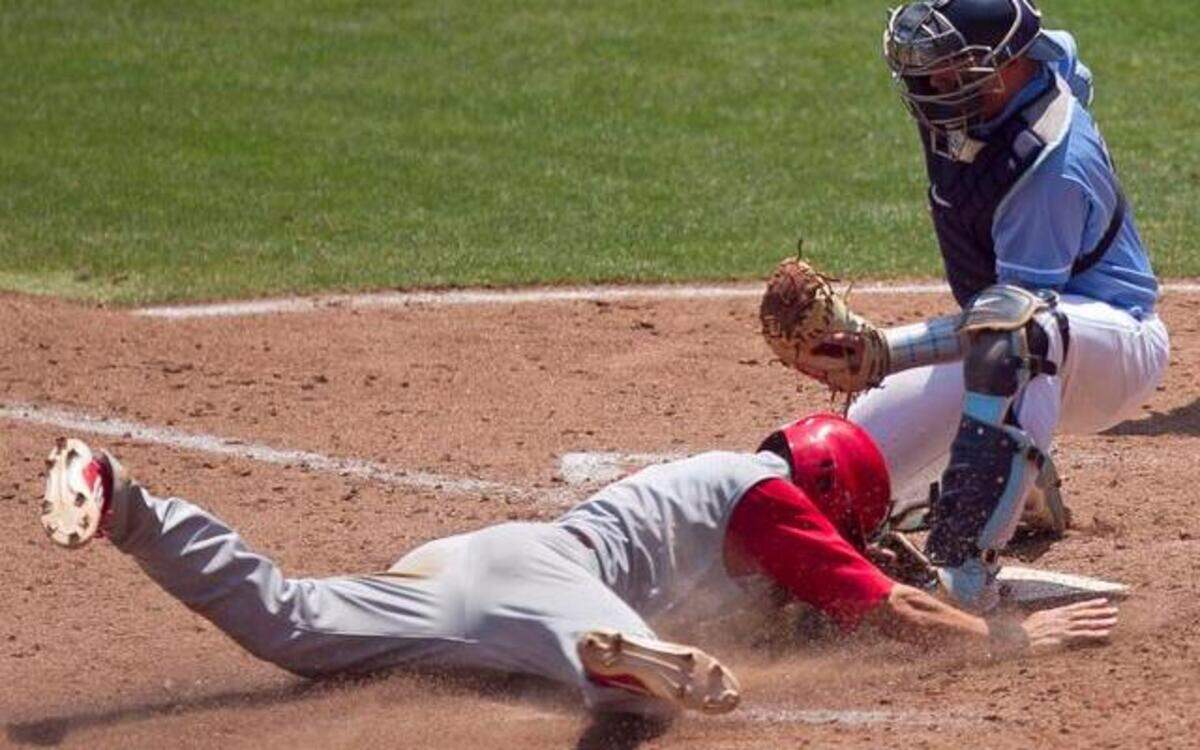 
UNC catcher Korey Dunbar (43) tags out N.C. State's Trea Turner (8) at home plate, after teammate Jake Fincher (30) struck out in the fifth inning, and Turner attempted to steal home during the ACC Baseball Championship on Tuesday May 20, 2014 in Greensboro, N.C.

