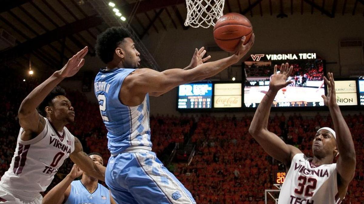 North Carolina’s Joel Berry II drives to the basket for a reverse layup against Virginia Tech’s Shane Henry (0) and Zach LeDay (32) during the first half at Cassell Coliseum in Blacksburg, Va. Berry II scored 13 points in the Tar Heels’ 75-70 victory.