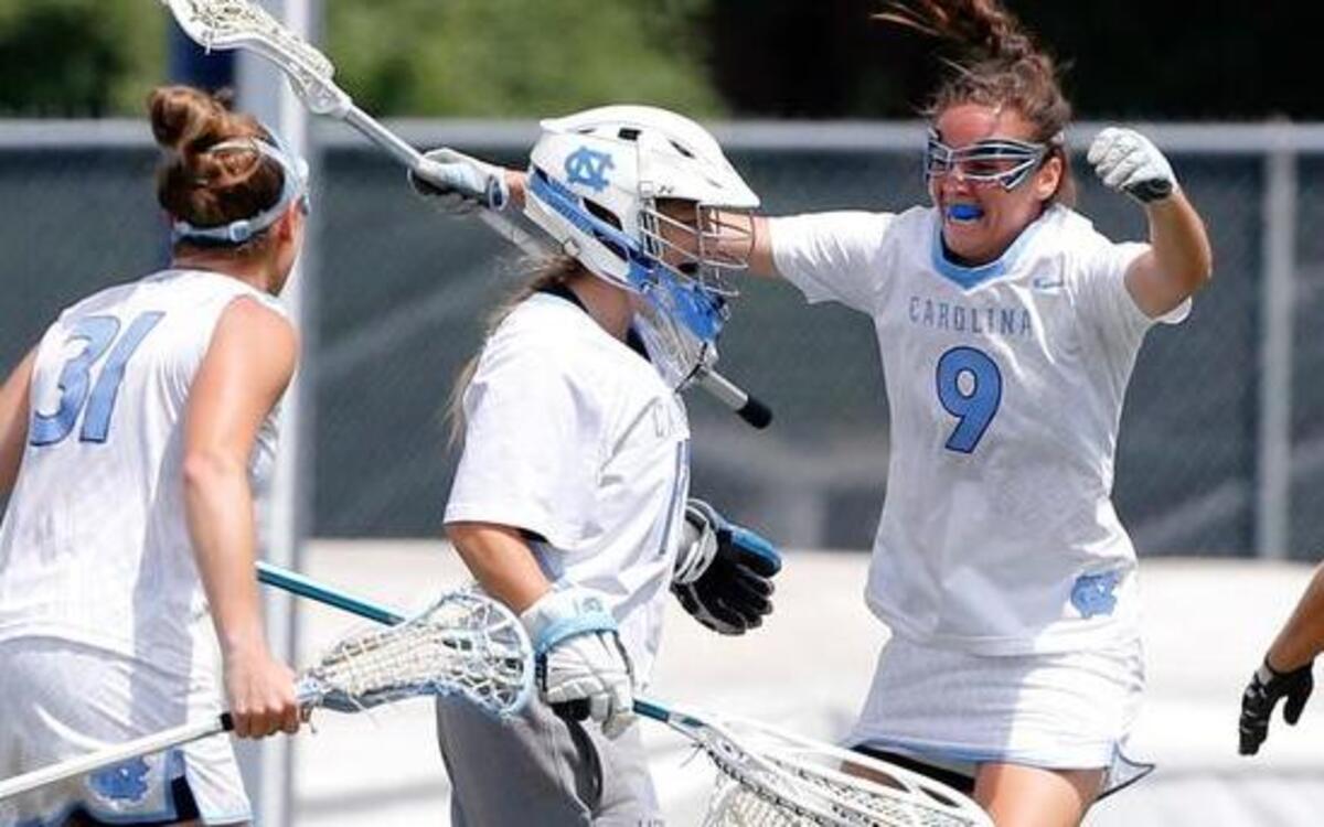 
From left, North Carolina's Caileigh Sindall (31), Margaret Corzel (9) and Mallory Frysinger (1) celebrate with goalie Megan Ward (17) as time runs out in UNC's 11-8 victory over Penn State in the NCAA women's college lacrosse quarterfinals at Fetzer Field in Chapel Hill Saturday, May 16, 2015.

