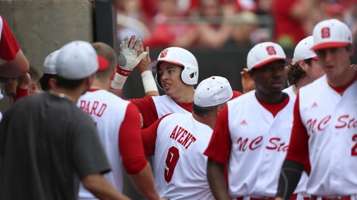 N.C. State third baseman Evan Mendoza (18) celebrates his home run in the dugout during the Wolfpack's 10-1 win over North Carolina on Saturday, May 21, 2016 at Doak Field in Raleigh.