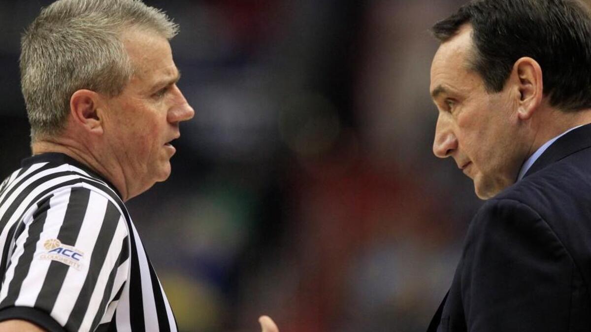 Official Bryan Kersey talks with Duke's Mike Krzyzewski during the first half of Duke's game against Notre Dame in the quarterfinals of the 2016 New York Life ACC Tournament at the Verizon Center in Washington, D.C., Thursday, March 10, 2016.