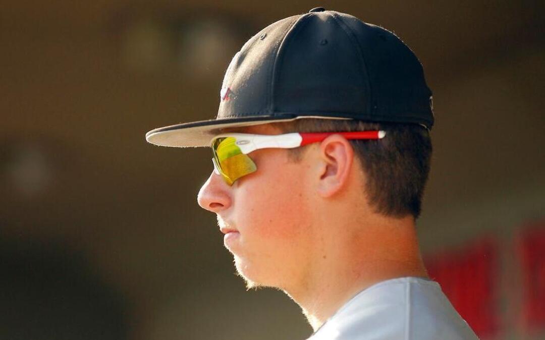 
Louisville's Brendan McKay (38) watches the activity on the field before an ACC college baseball game played between Louisville and N.C. State at Doak Field on the N.C. State campus in Raleigh on May 14, 2015.
