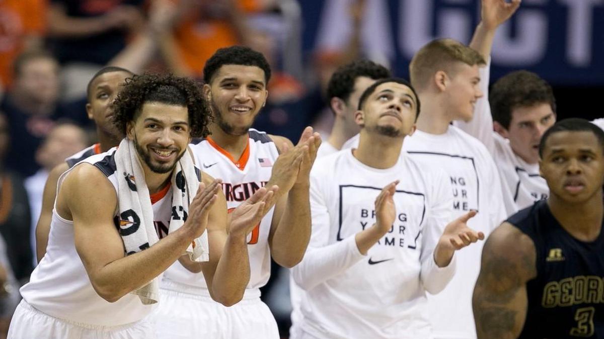 Virginia’s Anthony Gill (13) leads the cheers from the bench as the Cavaliers open a 10-point lead over Georgia Tech during the second half on Thursday, March 10, 2016 during the ACC Tournament at the Verizon Center in Washington, D.C.
