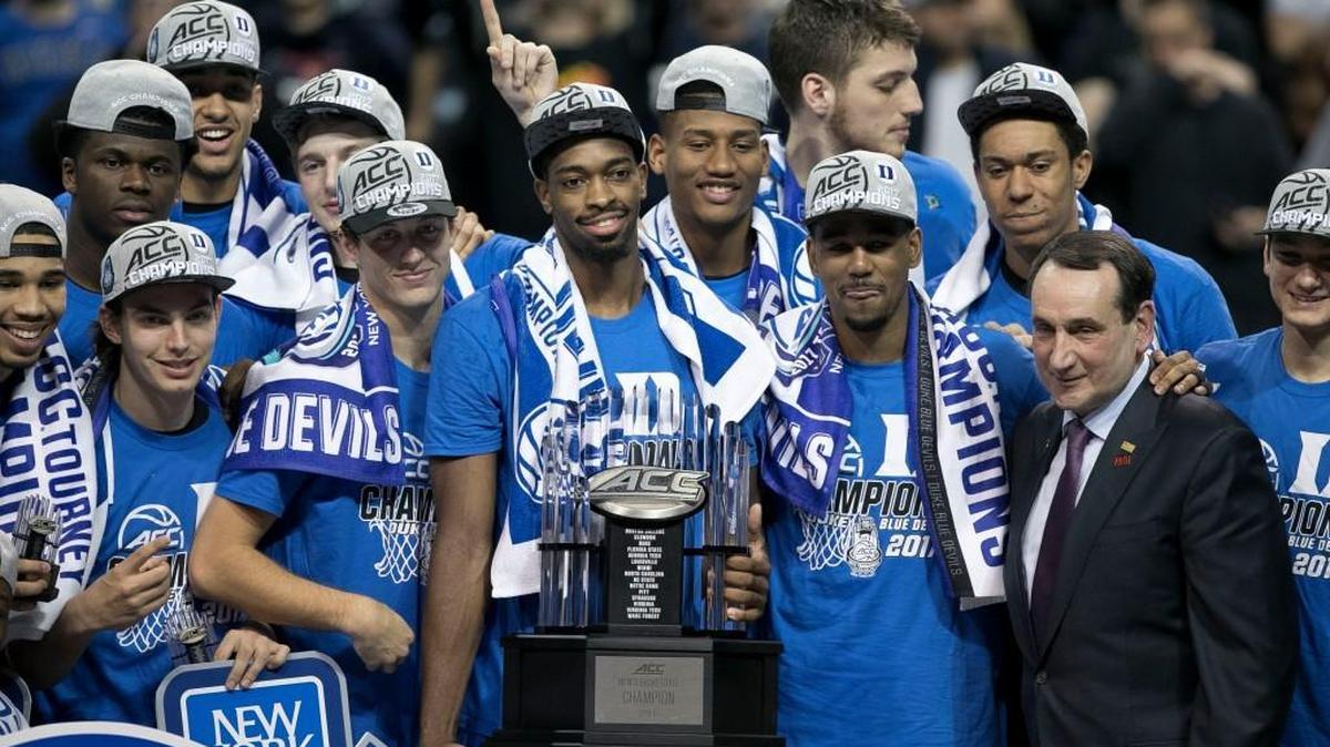 Duke’s Amile Jefferson (21) holds the championship trophy as the Blue Devils celebrate their 75-69 victory over Notre Dame to win the ACC yournament on March 11, 2017 at the Barclays Center in Brooklyn, N.Y.