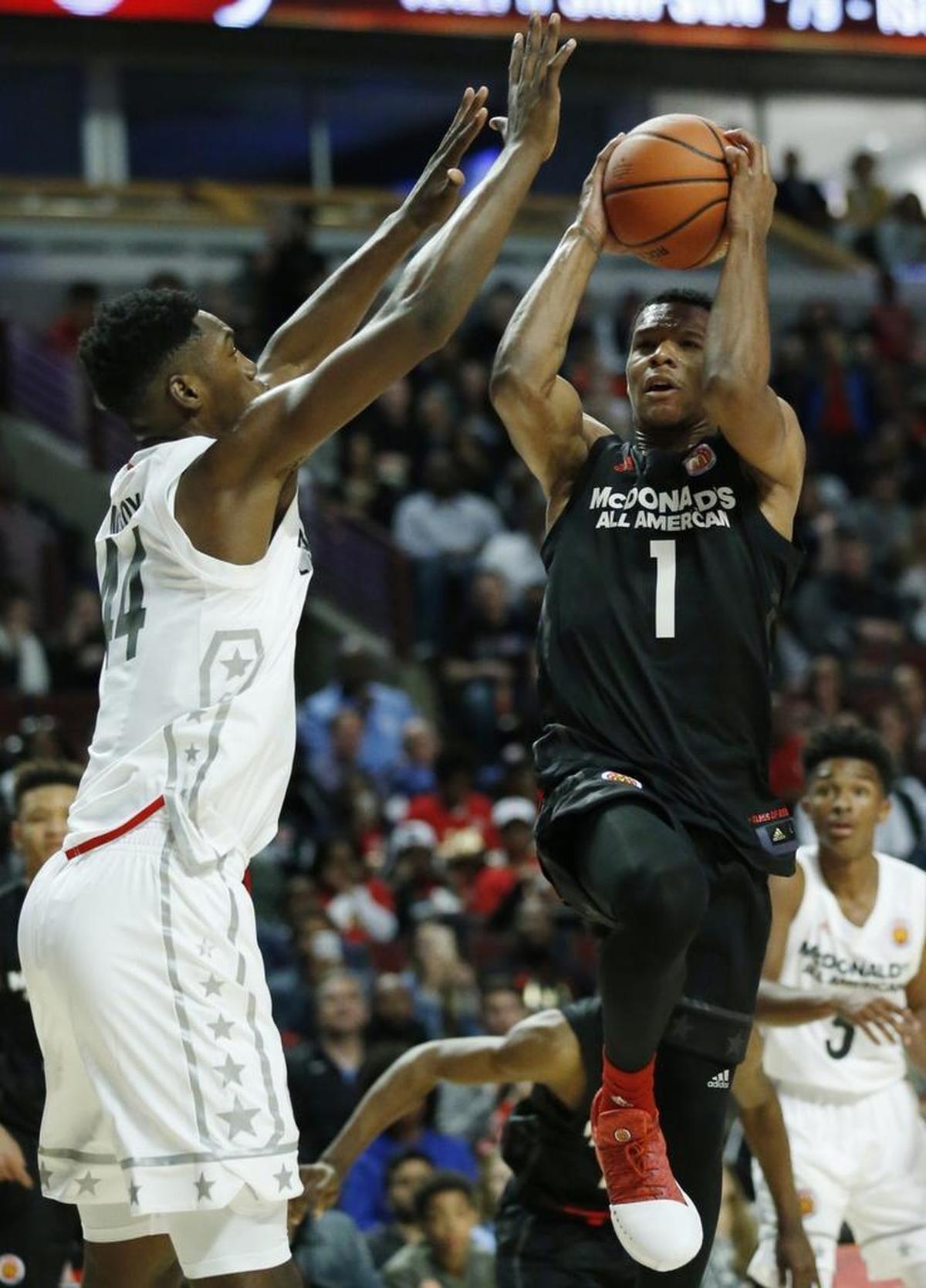 Trevon Duval, right, drives to the basket against Brandon L. McCoy during the McDonald's All-American game in Chicago in March. Duval has signed with Duke.