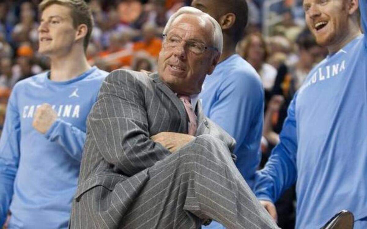 
North Carolina coach Roy Williams uses body english as he watches a three-point attempt by Marcus Paige cut the Louisville lead to 37-35 at the start of the second half on Thursday, March 12, 2015.
