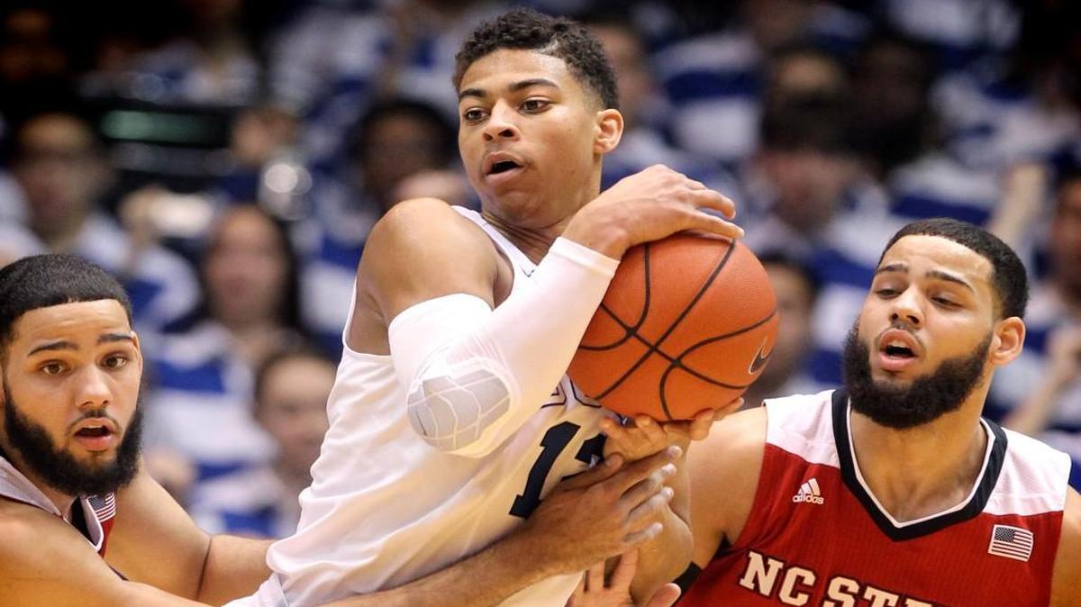 N.C. State's Caleb Martin (14), left, and Cody Martin (15) pressure Duke's Derryck Thornton (12) during the first half of the Wolfpack's game against Duke at Cameron Indoor Stadium in Durham, N.C., Saturday, Feb. 6, 2016.