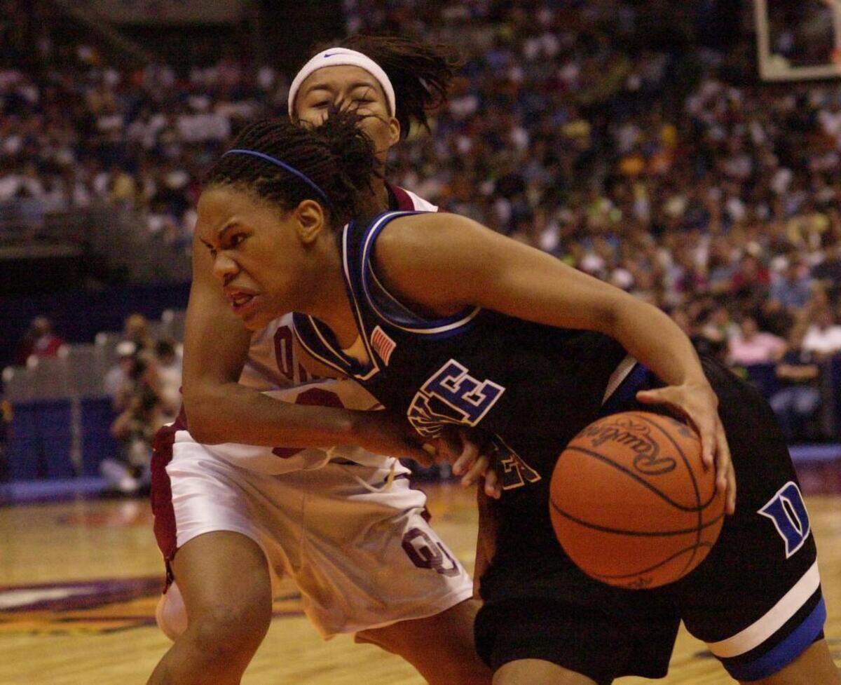 Monique Currie drives to the basket against Oklahoma’s LaNeishea Caufield in the Final Four in 2002.