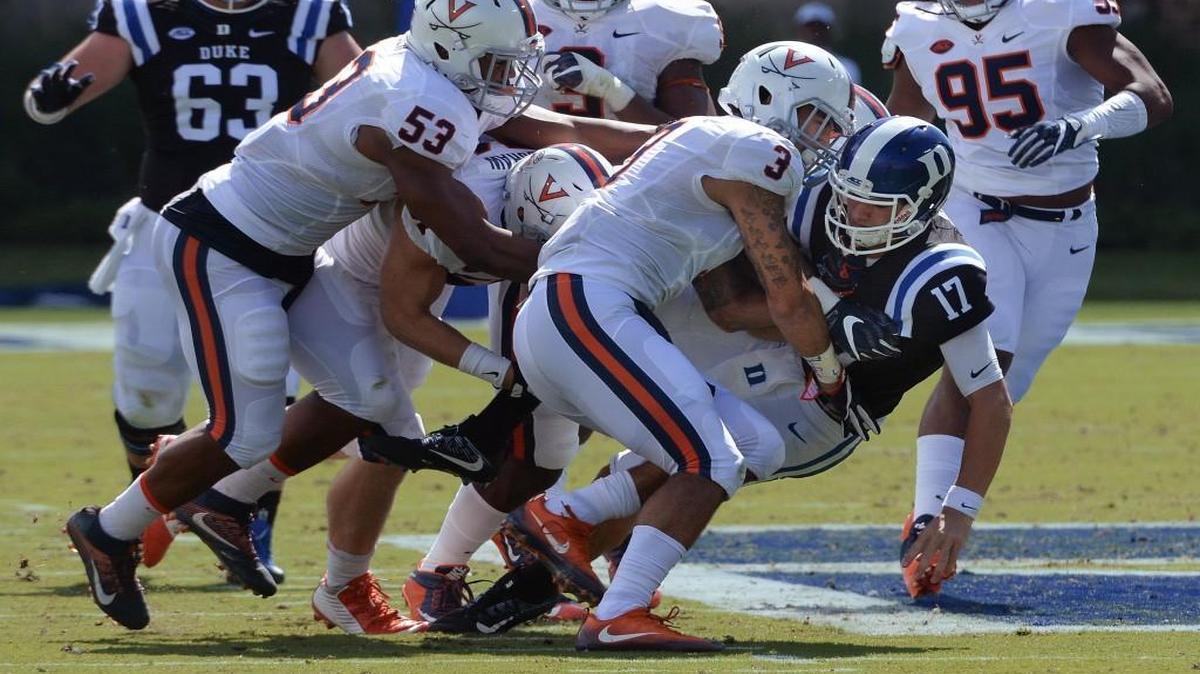 Duke quarterback Daniel Jones (17) is tackled by Virginia's Quin Blanding (3) in the second quarter at Wallace Wade Stadium.