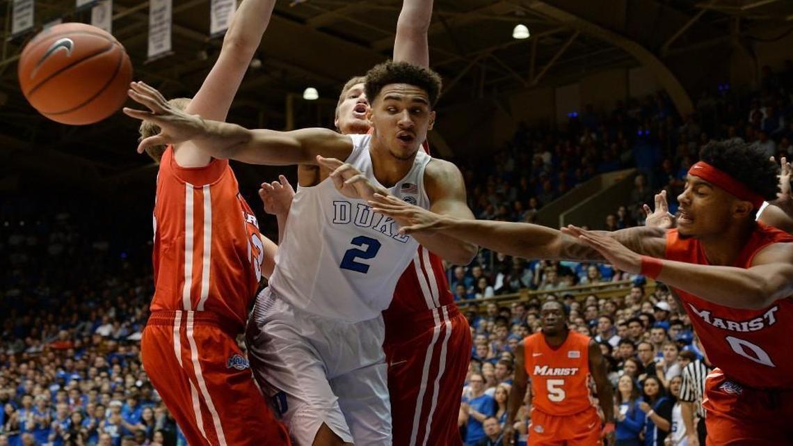 Duke’s Chase Jeter kicks the ball out as Marist’s Richie Mitchell (0) defends in the first half at Cameron Indoor Stadium.