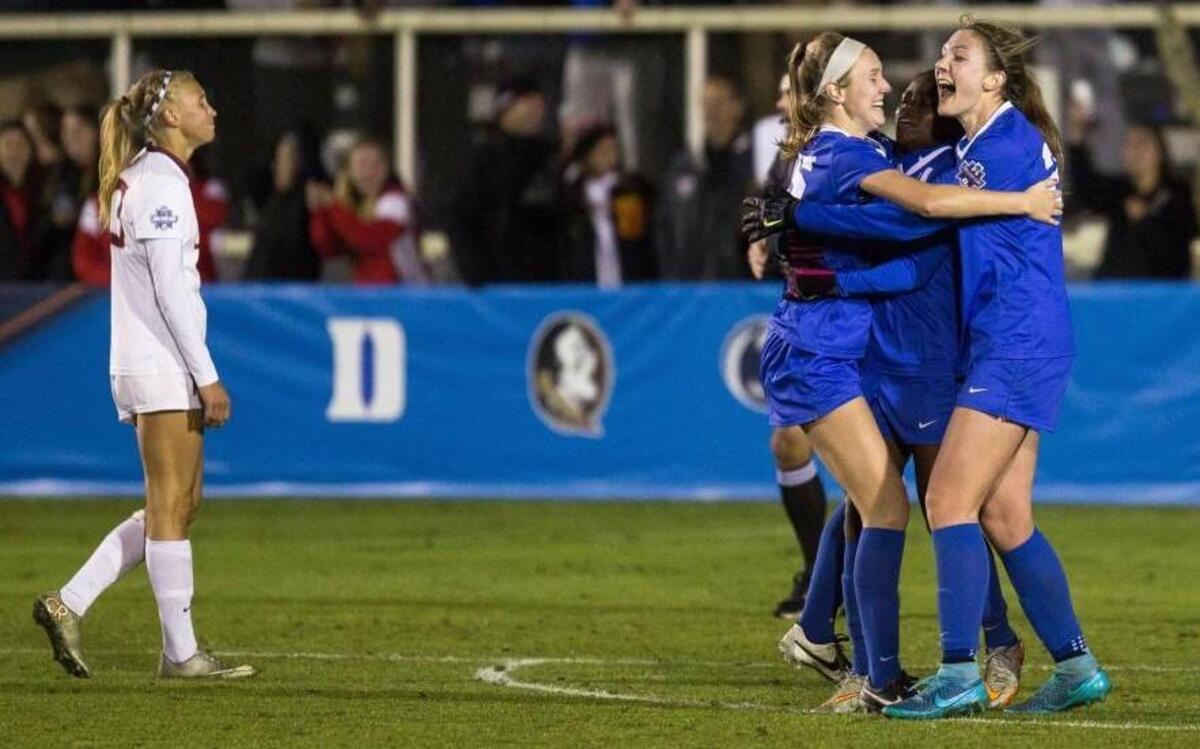 Duke’s Kara Wilson, third from right, Toni Payne, second from right, and Duke’s Malinda Allen, right, celebrate after Payne scored a goal to seal a win over Florida State in an NCAA Women's College Cup soccer semifinal in Cary.