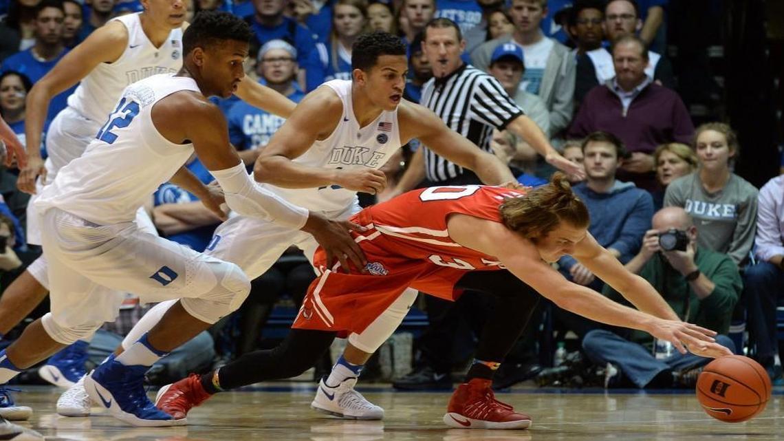 Marist’s Ryan Funk (30) races for a loose ball as Duke’s Javin DeLaurier (12) and Duke Frank Jackson (15) look for the steal in the second half at Cameron Indoor Stadium.