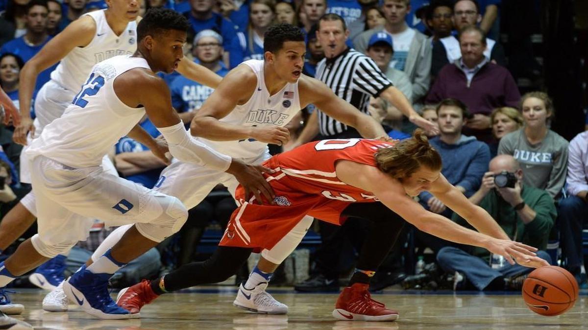 Marist’s Ryan Funk (30) races for a loose ball as Duke’s Javin DeLaurier (12) and Duke Frank Jackson (15) look for the steal in the second half at Cameron Indoor Stadium.