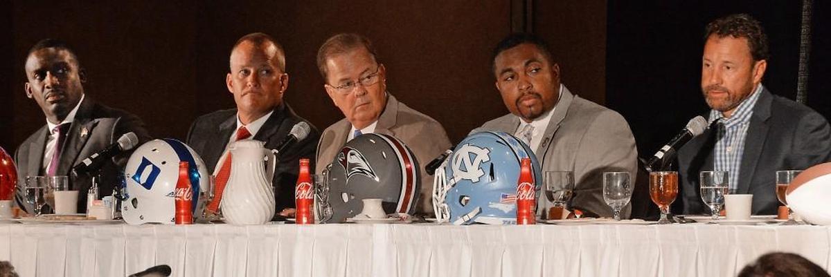 Coaches from the local Division I college football programs spoke at the Bill Dooley Pigskin Preview in July. Featured were, left to right, East Carolina head coach Scottie Montgomery, N.C. State coach Dave Doeren, Duke coach David Cutcliffe, N.C. Central coach Jerry Mack and UNC coach Larry Fedora.