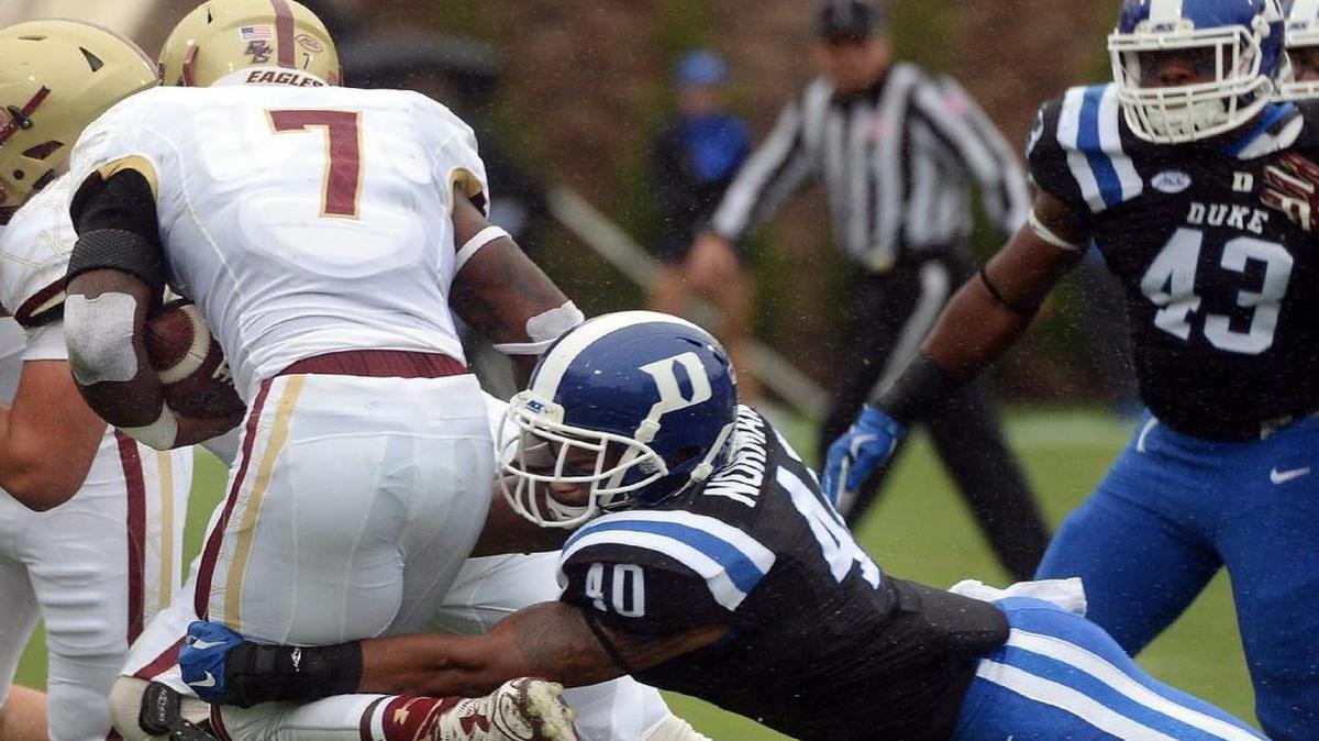 
Duke linebacker Dwayne Norman (40) sacks Boston College running back Marcus Outlow (7) in the first quarter at Wallace Wade Stadium in Durham, N.C. Saturday, October 3, 2015.
