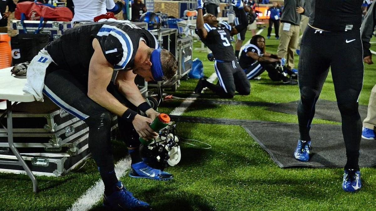 Duke quarterback Thomas Sirk (1) teammates, cornerback Johnathan Lloyd (5) and cornerback Jeremy McDuffie (9) react after Miami scores the winning touchdownat Wallace Wade Stadium in Durham, N.C. Saturday October 31, 2015.