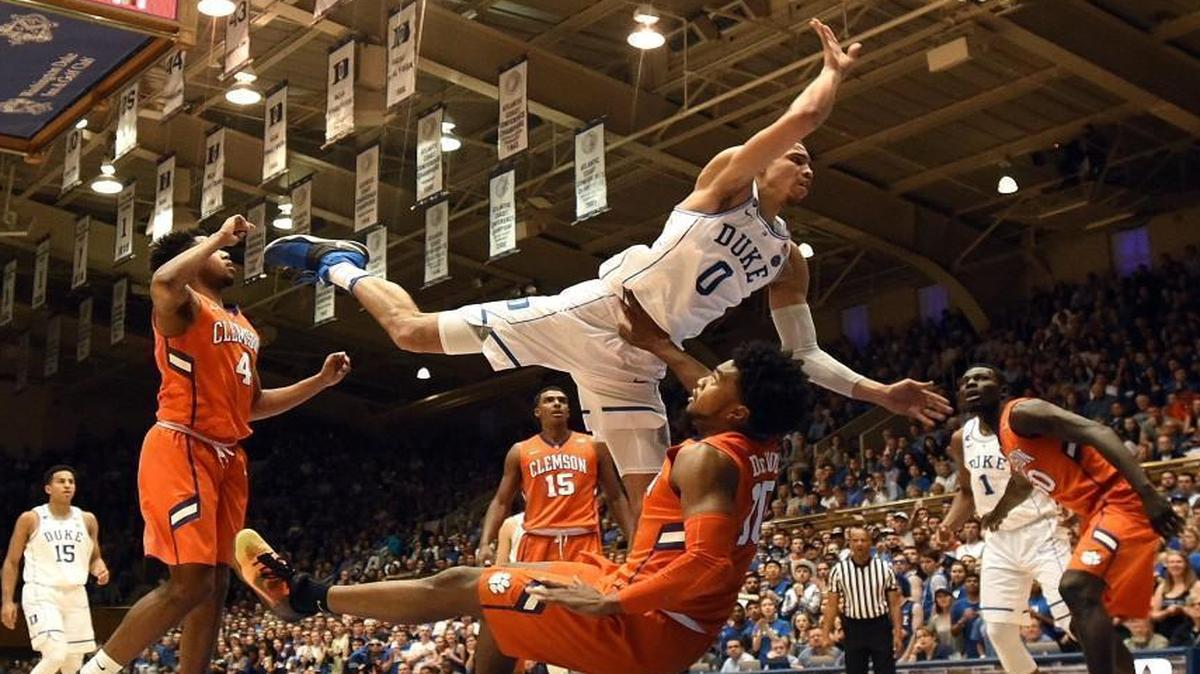 Duke’s Jayson Tatum (0) is fouled by Clemson’s Gabe DeVoe (10) as he goes in for a first-half shot at Cameron Indoor Stadium in Durham.