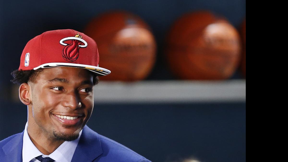
Justise Winslow waits to be interviewed after being selected 10th overall by the Miami Heat during the NBA basketball draft in New York. 
