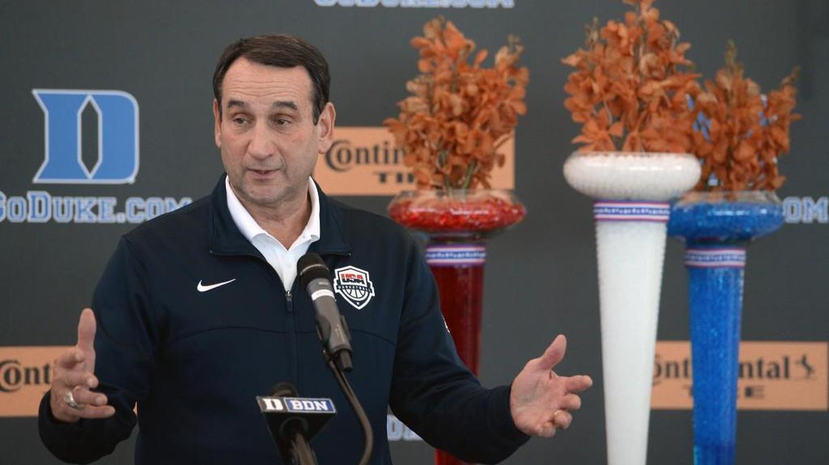 Team USA and Duke basketball coach Mike Krzyzewski speaks with the media as he arrives with his family at RDU Airport on Aug. 22. Krzyzewski led the US team to their third straight gold medal in the Rio Olympics.