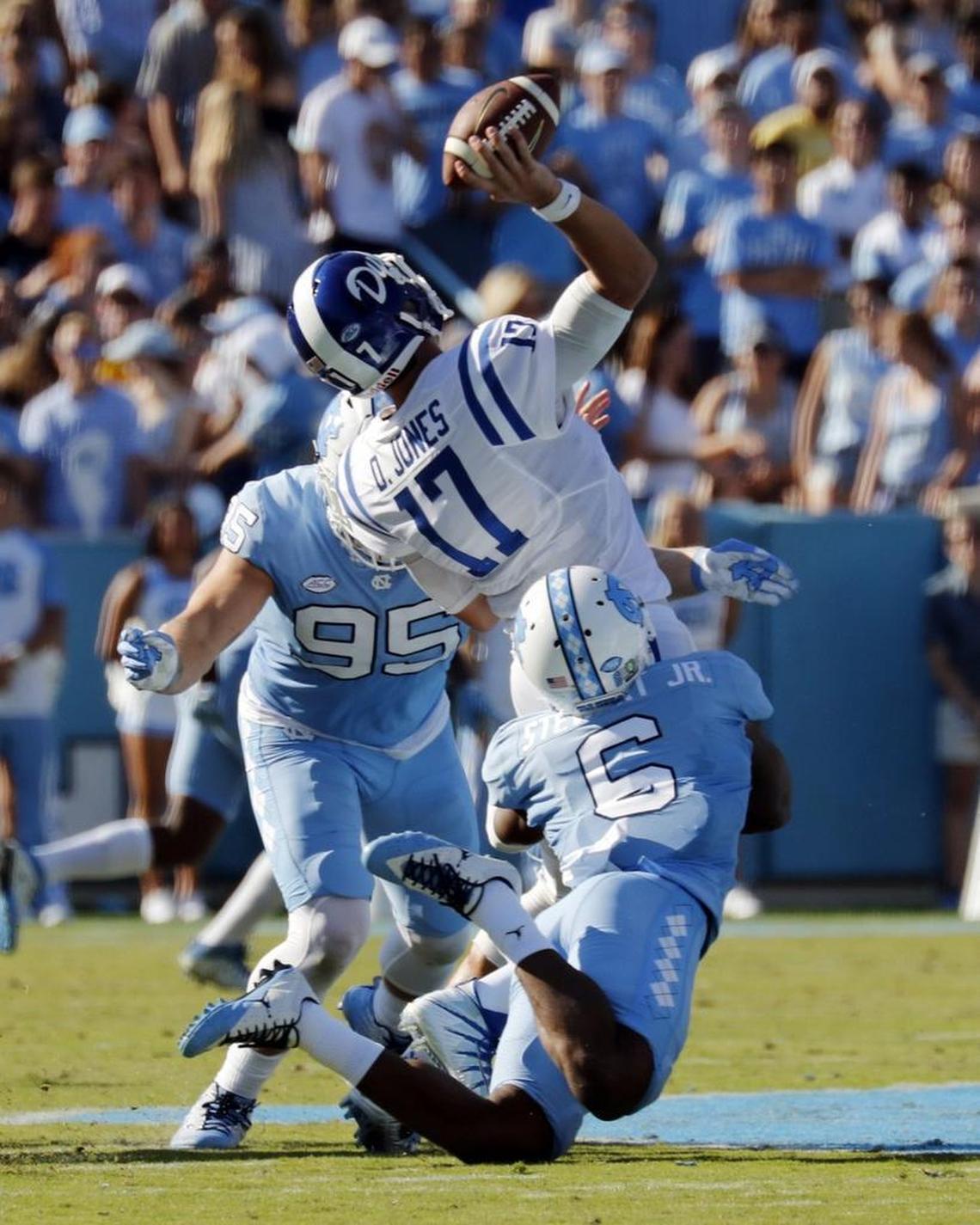 UNC's Tyler Powell (95) and M.J. Stewart (6) sack Duke's Daniel Jones (17) during the second quarter at Kenan Stadium in Chapel Hill on Sept. 23, 2017.