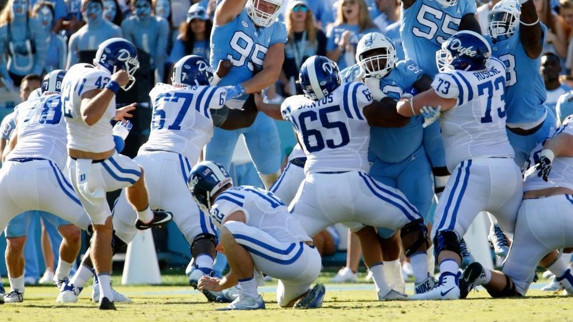 UNC's Jason Strowbridge (55) blocks a field goal attempt by Duke's Austin Parker (42) during the second quarter of an ACC football game between the UNC Tar Heels and the Duke Blue Devils played at Kenan Stadium in Chapel Hill, NC, on Sept. 23, 2017. UNC scored on the ensuing drive.