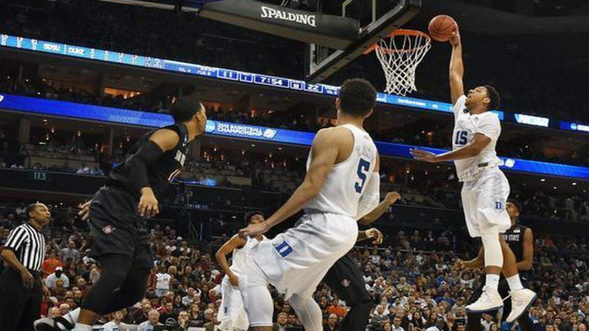 Duke center Jahlil Okafor finishes a dunk against San Diego State on Sunday afternoon during the Blue Devils’ 68-49 win at Time Warner Cable Arena in Charlotte.