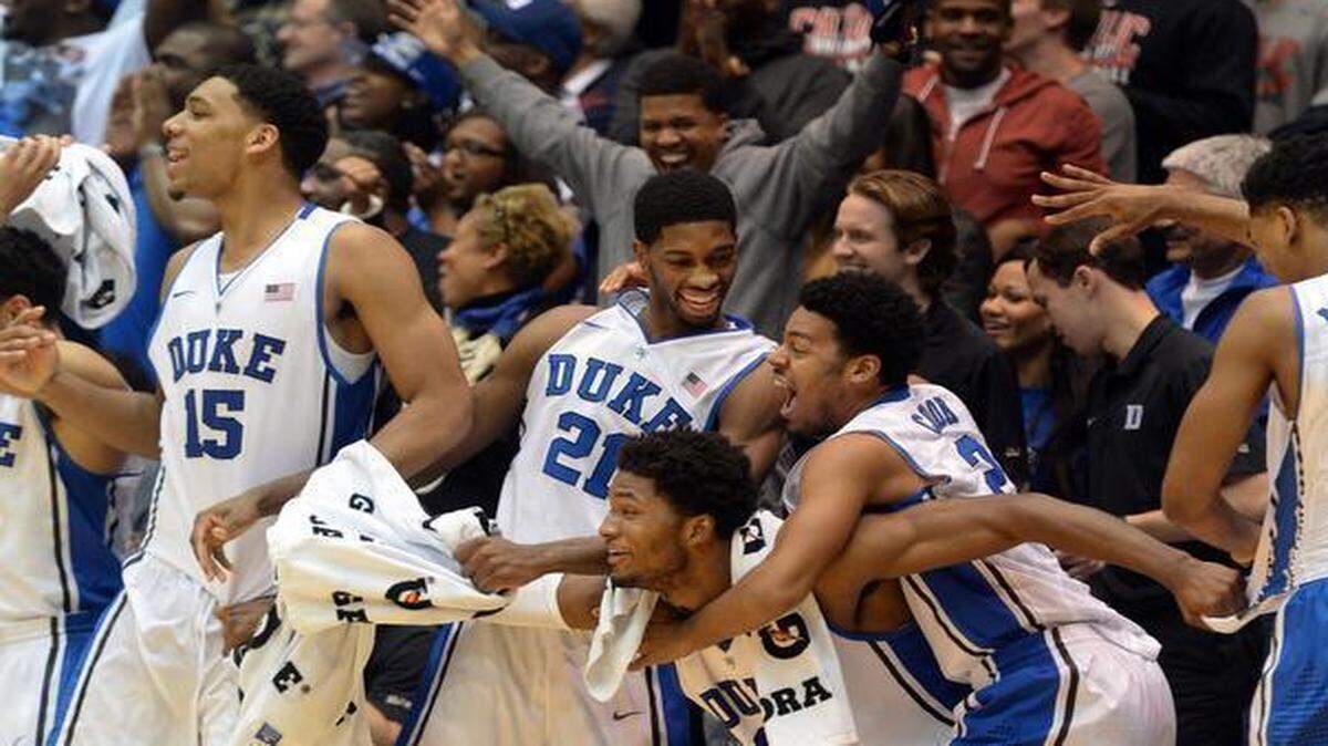 
The Duke bench explodes in the closing seconds of the game against the Blue Hose as center Duke center Marshall Plumlee (40) hits a three pointer. Celebrating left to right are center Jahlil Okafor (15), forward Amile Jefferson (21), forward Justise Winslow (12), guard Quinn Cook (2) and guard Matt Jones (13). Duke won their season opener 113-44 over Presbyterian at Cameron Indoor Stadium in Durham, NC Friday, November 14, 2014.
