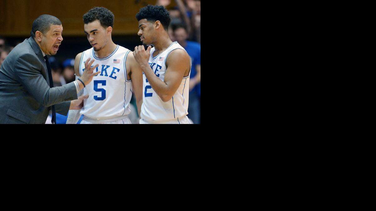 

Duke assistant coach Jeff Capel speaks with Duke guards Tyus Jones, center, and Quinn Cook during the Jan. 13 loss to Miami.
