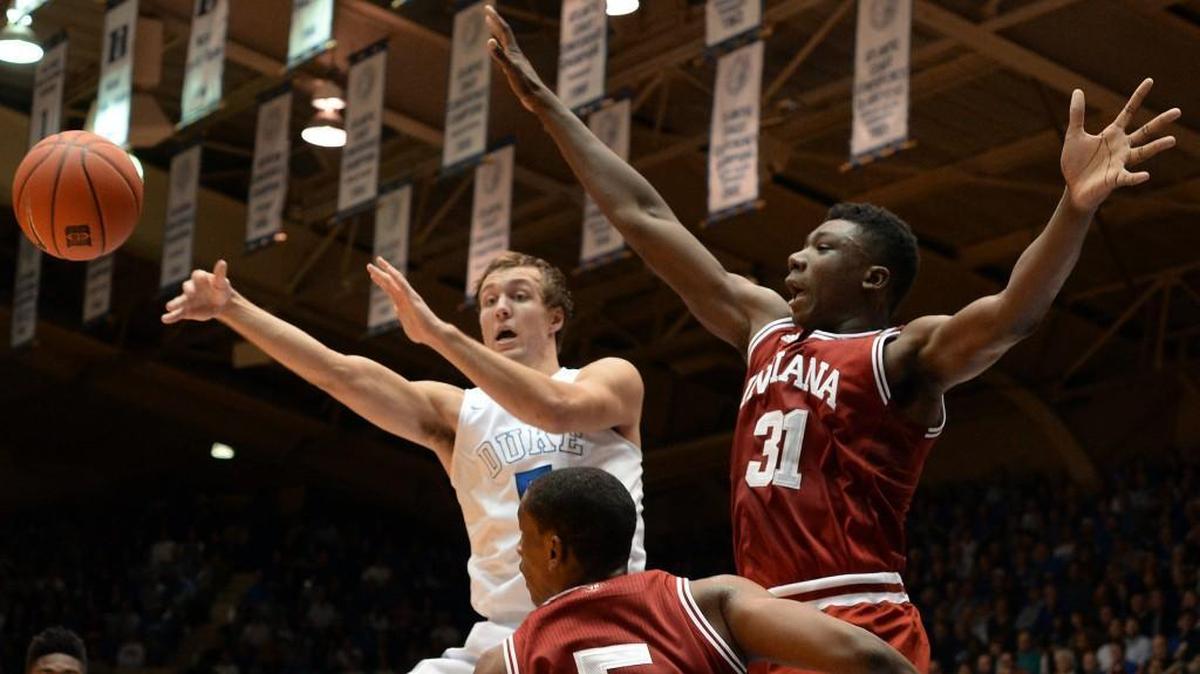 Duke guard Luke Kennard kicks the ball outside as Indiana center Thomas Bryant (31) defends on Dec. 2. Kennard’s uneven progress reminds coach Mike Krzyzewski of last year’s performance of Grayson Allen.