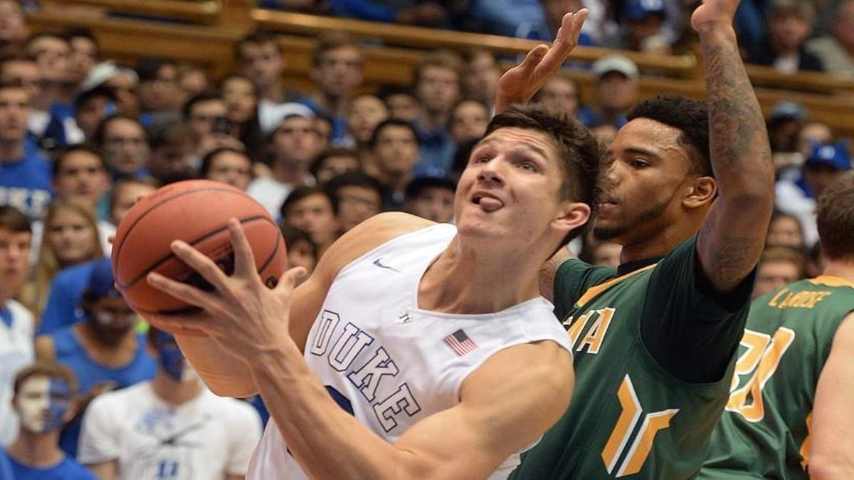 Duke guard Grayson Allen goes in to score two of his game-high 26-points past Siena guard Marquis Wright (guards in the second half at Cameron Indoor Stadium in Durham.