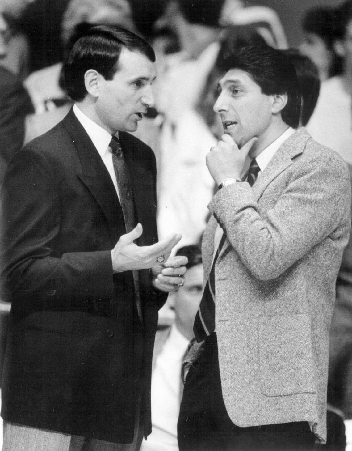 Duke coach Mike Krzyzewski talks with Jim Valvano before a game in January 1989 in Raleigh.