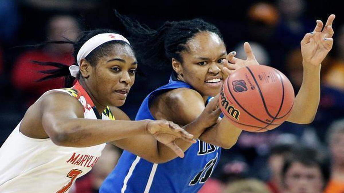 
Maryland's Kiara Leslie (2) and Duke's Azura Stevens (11) chase a loose ball during the first half of a women's college basketball regional semifinal game in the NCAA tournament, Saturday, March 28, 2015, in Spokane, Wash. 
