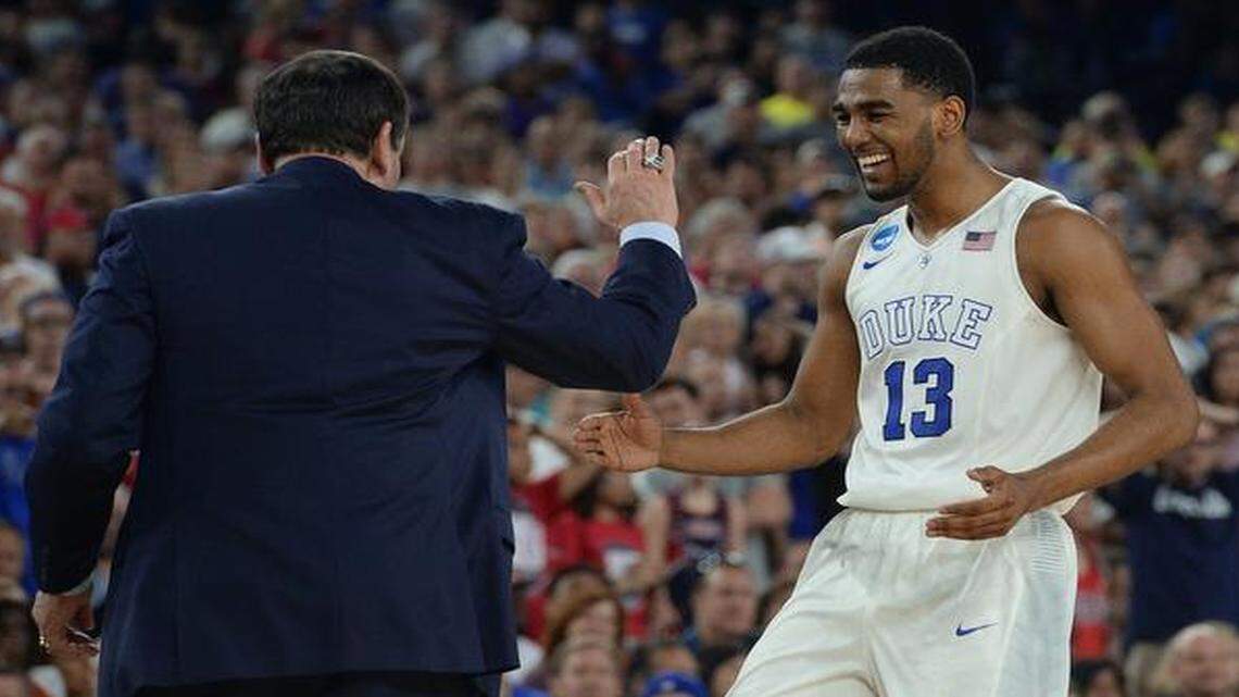 
Duke coach Mike Krzyzewski greets guard Matt Jones as he heads towards the bench near the end of the Blue Devils’ 66-52 win over Gonzaga. 
