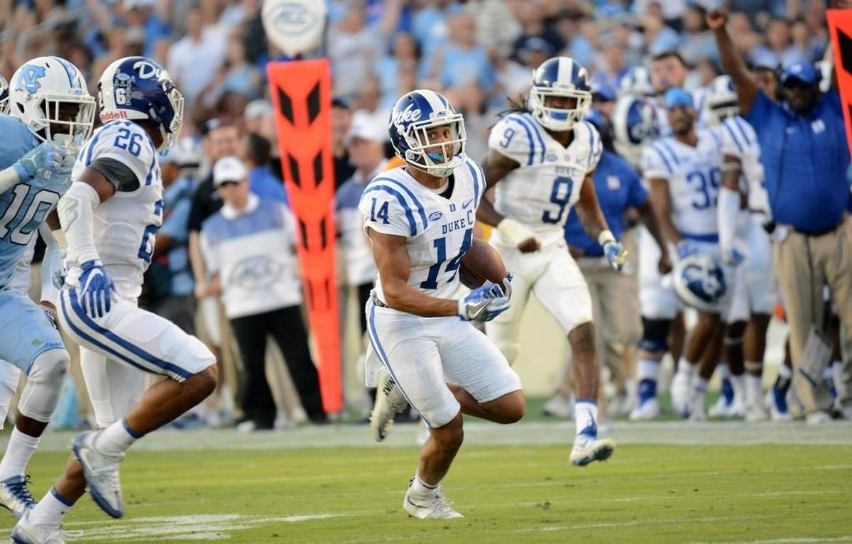 Duke's Bryon Fields returns a 61-yard interception against UNC in the 4th quarter.