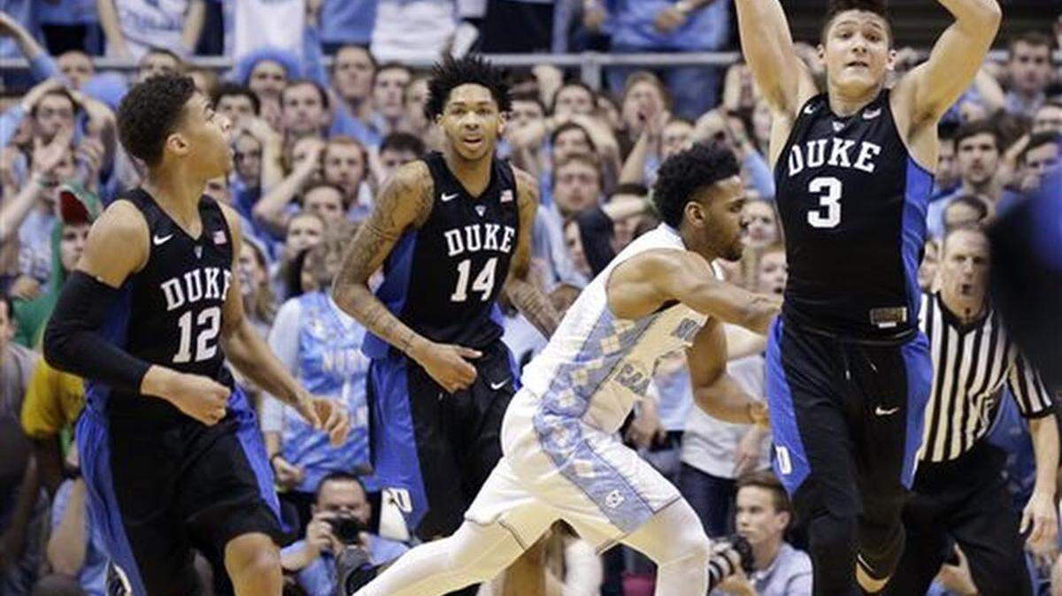 Duke's Derryck Thornton (12), Brandon Ingram (14) and Grayson Allen (3) react as time expires while North Carolina's Joel Berry II runs off of the court following an NCAA college basketball game in Chapel Hill, N.C., Wednesday, Feb. 17, 2016. Duke won 74-73.