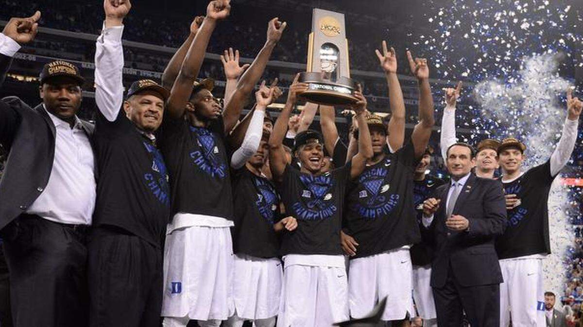 
The Blue Devils hoist their fifth NCAA national championship trophy after they defeated Wisconsin 68-63 for the NCAA national championship in the Final Four at Lucas Oil Stadium at Indianapolis, Indiana, Monday, April 6, 2015.
